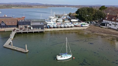 Aerial of Dell Quay in Chichester Harbour Estuary England with Sailing Boats and Sailing Dinghies at this popular sailing destination.
