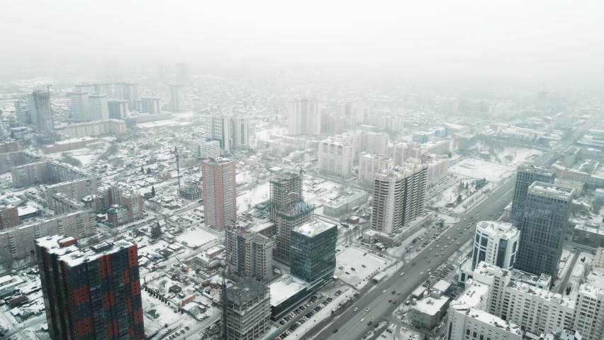 Aerial photography of a winter city in a blizzard. | Shutterstock HD Video #1088453449