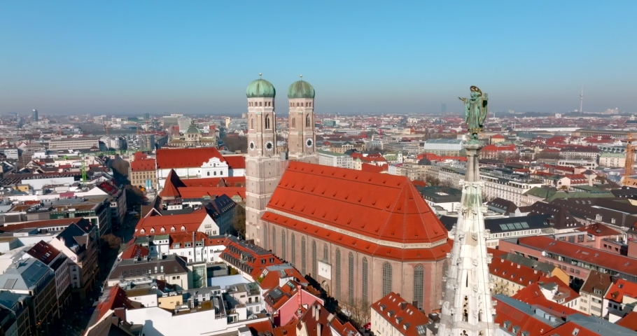 Beautiful Munich panoramic architecture in Bavaria, Germany. Aerial view of the Frauenkirche and town hall on Marienplatz. Royalty-Free Stock Footage #1088458367