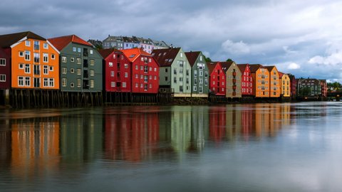 Trondheim, Norway. City center of Trondheim, Norway during the cloudy summer day. Time-lapse of historical colorful building and grey cloudy sky, zoom in