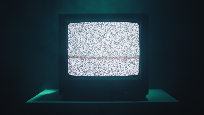 Vintage television with bad signal in the night 