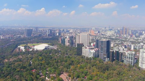MEXICO CITY, MEXICO, NORTH AMERICA - CIRCA 2020: Aerial view of capital of Mexico, Auditorio Nacional in park Bosque de Chapultepec, skyline with modern high-rise buildings (skyscrapers) - landscape