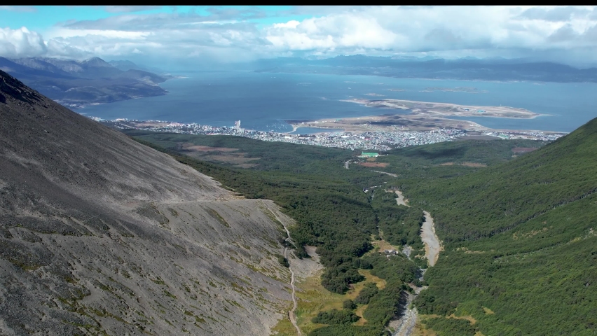 Top cinematic aerial view to the mountain landscape in Argentina. Mountain river from above. Drone footage. 