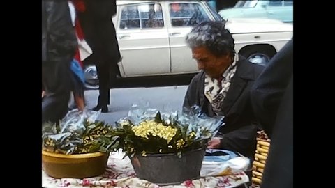 paris, france march 18 1960:Woman Shopping for Flowers from a Market Stall