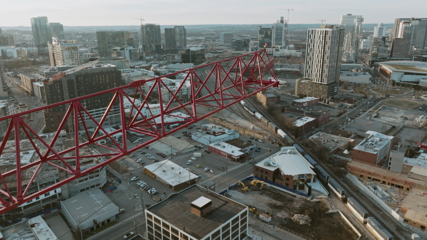 Close aerial flyover of a construction crane in downtown Nashville, TN.