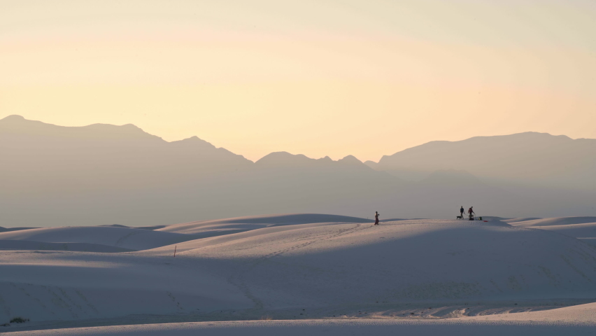 Sunset view of people on dunes at White Sands National Park New Mexico, 4K