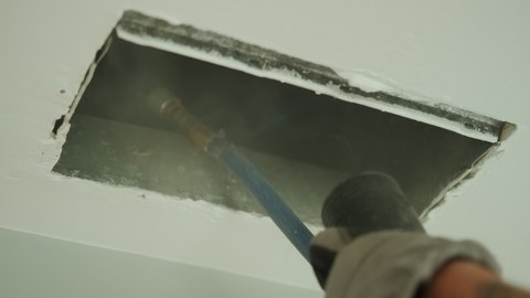  Home Duct Cleaning Services, ventilation cleaner man at work with tool on the floor. Slow motion footage Close up footage.