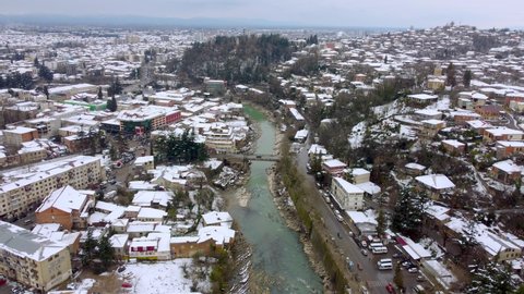 Kutaisi, Georgia - March 18, 2022: Aerial view of the Rioni river and the city of Kutaisi.