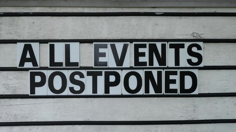 All Events Postponed sign in small community during Covid 19 Coronavirus pandemic.
