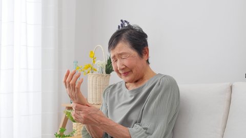 Asian senior woman having the joint pain