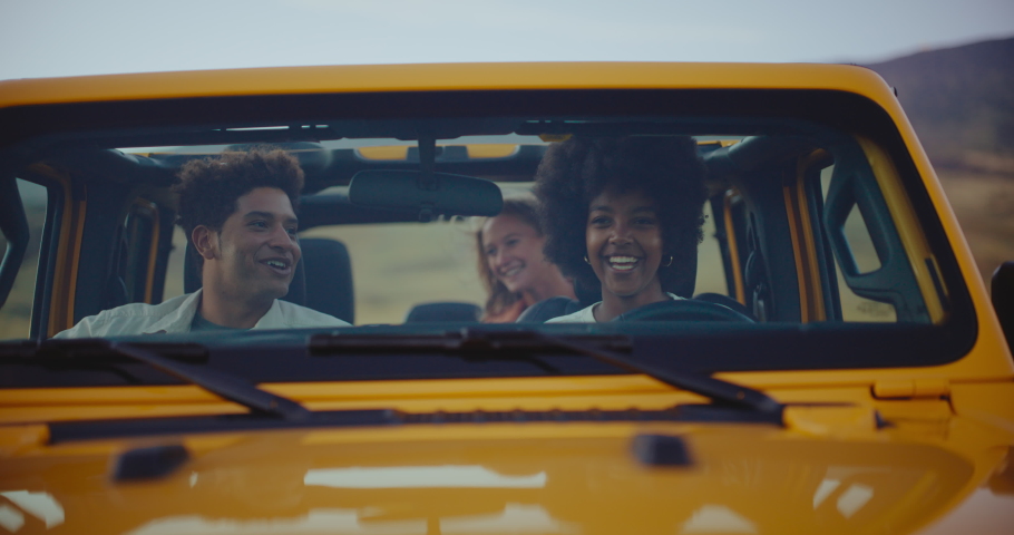 Three best friends laughing and relaxing on epic road trip, freedom and travel lifestyle Royalty-Free Stock Footage #1088483745