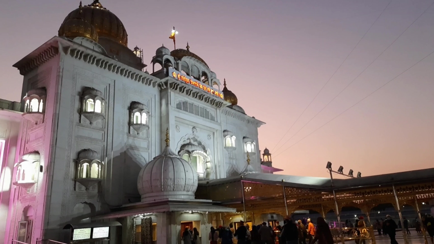Gurdwara Bangla Sahib is the most prominent Sikh Gurudwara, Bangla Sahib Gurudwara inside view during evening time in New Delhi, India, Sikh Community one of the famous gurudwara Bangla Sahib view | Shutterstock HD Video #1088487131