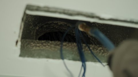  Home Duct Cleaning Services, ventilation cleaner man at work with tool on the floor. Slow motion footage Close up view.