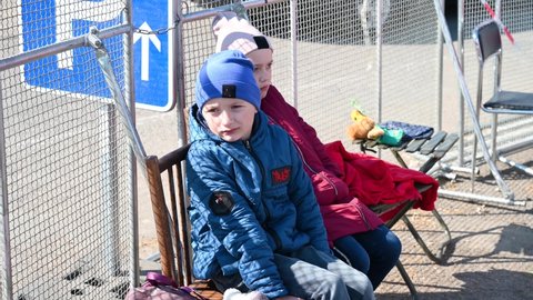 Vyšné Nemecké, Slovakia, March 2022: Children refugees from Ukraine escaping from war. Ukrainian refugees crossing the border. Ukrainians fleeing the war.