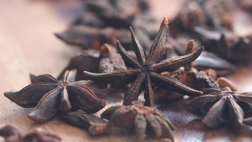 Close up footage of star anise spice on wooden board. Royalty-Free Stock Footage #1088493523