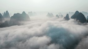 Aerial footage of beautiful mountain and clouds with fog natural landscape in Guilin at sunrise, China. famous tourist destination in china.