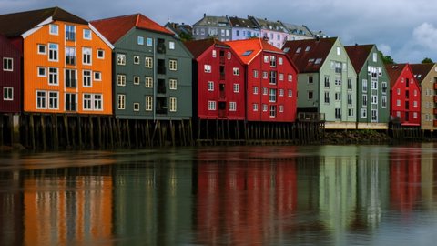 Trondheim, Norway. City center of Trondheim, Norway during the cloudy summer day. Time-lapse of historical colorful building and grey cloudy sky, panning video