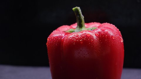 Static video,wet and red bell pepper closeup with water drops