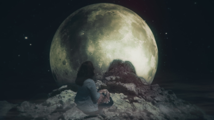 Moonlight Woman Sitting On Cliff at Night, Full Moon Zoom Out. Woman standing on top of a mountain looking at the full moon in starry space. Zoom in