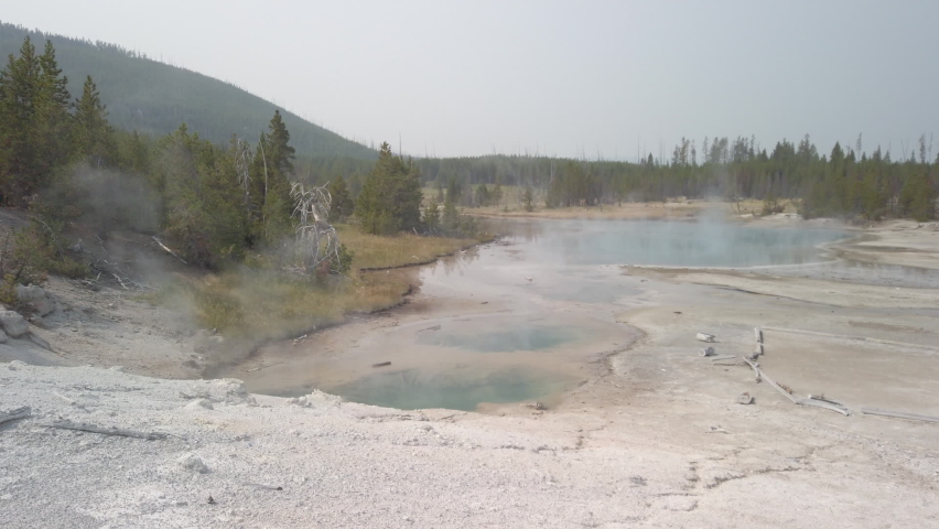 Hot spring with steam in nature