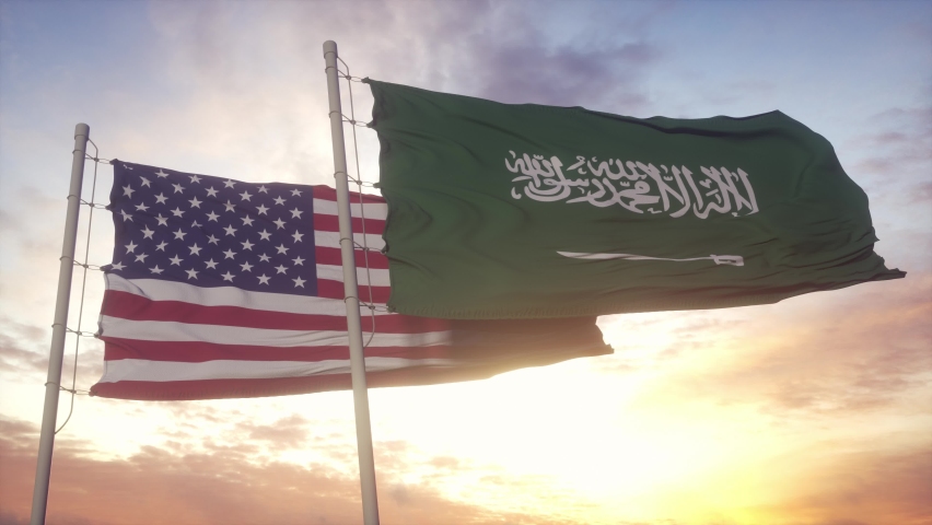 Saudi Arabia and USA flag on flagpole. Saudi Arabia and USA waving flag in wind. Saudi Arabia and USA diplomatic concept