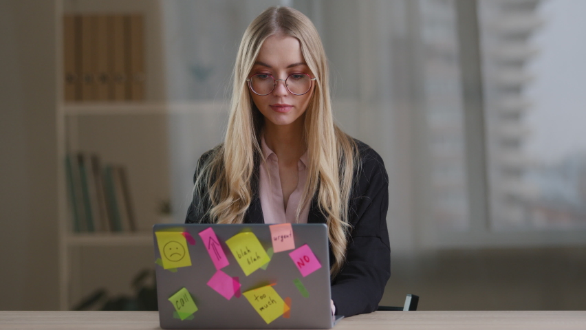 Multitasking business woman manager in office sitting at table have many tasks work feeling stress overworked exhausted from hands with calculator notebook papers phone tired girl in glasses headache Royalty-Free Stock Footage #1088503185