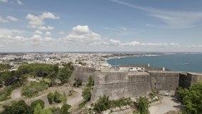 Setubal fortress and coastline, Portugal. Aerial rising