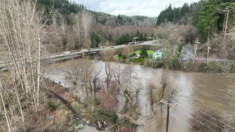 Cinematic 4K aerial drone shot of flooding, rising Duwamish, Green River in Auburn, King County Washington