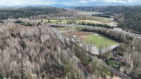 Cinematic 4K bird'-eye drone shot of flooding on the Duwamish, Green River by the Neely Mansion in Auburn, King County Washington