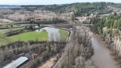 Cinematic 4K bird'-eye drone shot of flooding on the Duwamish, Green River in Auburn, King County Washington