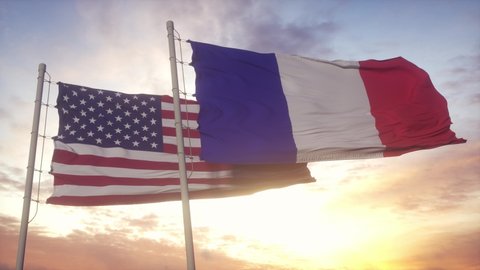 USA and France flag on flagpole. USA and France waving flag in wind. USA and France diplomatic concept