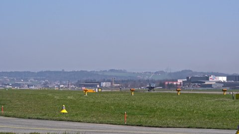 US fighter McDonnell Douglas FA-18 Hornet register J-5001 from Swiss Air Force taking off from Airbase Emmen on a sunny spring day. Movie shot March 23rd, 2022, Emmen, Switzerland.