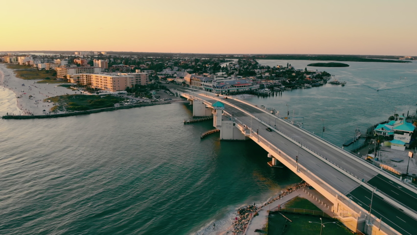 Johns Pass Madeira Beach AERIAL. Strait and waterfront that is south Florida in St. Petersburg. Strait and drawbridge at sunset.