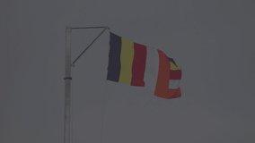 flag of Sri Lanka is flying on the flagpole. Slow motion 120 fps video, ProRes 422, 10 bit, ungraded C-LOG 3
