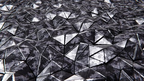 Realistic looping abstract 3D animation of the moving dark and scratched grimy camouflage metallic triangles pattern rendered in UHD as motion background