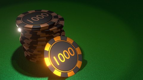Poker chips with inscription 1000 in golden black colors on gambling table. Casino concept.