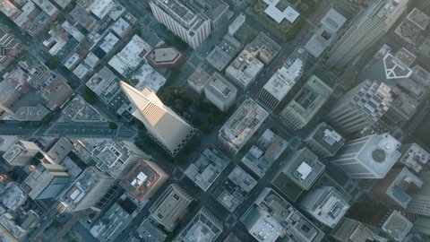 Aerial birds eye overhead top down view perspective of San Francisco City Skyscrapers streets. Urban canyon road in San Francisco with empty streets with no car traffic in early morning light, USA 4K