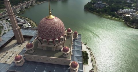 Drone circling over the beautiful Putra Mosque in Putrajaya, Malaysia