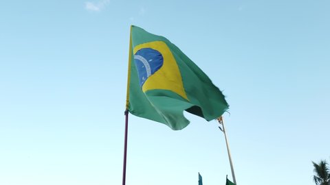 Rio de Janeiro, RJ, Brazil - March 21st 2022 - Brazilian flag waving in the wind. Brazil flag shaking. Green, yellow and blue flag. South America. Flag pole.