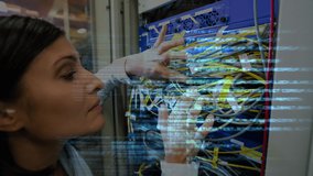 Animation of data processing over biracial woman connecting wires at server. computers, technology, data processing, connections and digital interface concept digitally generated video.