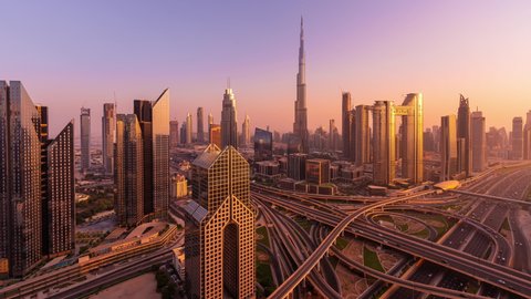 Dubai, United Arab Emirates - October 22 2021: Day to Night Timelapse of the skyline of Dubai and the busy intersection at Sheikh Zayed Road. Burj Khalifa is in the background