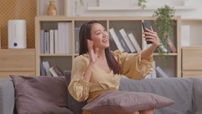 Asian girl contacts with friends through video call. Mobile distance virtual meeting. Stories of all social media contacted recorded by smart devices, cell phone, smart phone. Technology smart life.