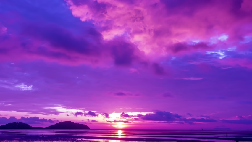 Cyberpunk color trend popular background. Timelapse nature Beautiful motion blur of Light Sunset or sunrise colorful Dramatic majestic scenery Sky with Amazing clouds in sunset sky purple light cloud