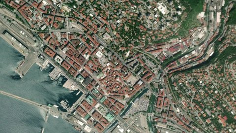 Earth zoom in from space and focus on Rijeka, Croatia. The animation continues by zoom out through clouds and atmosphere into space. Background for travel intro.