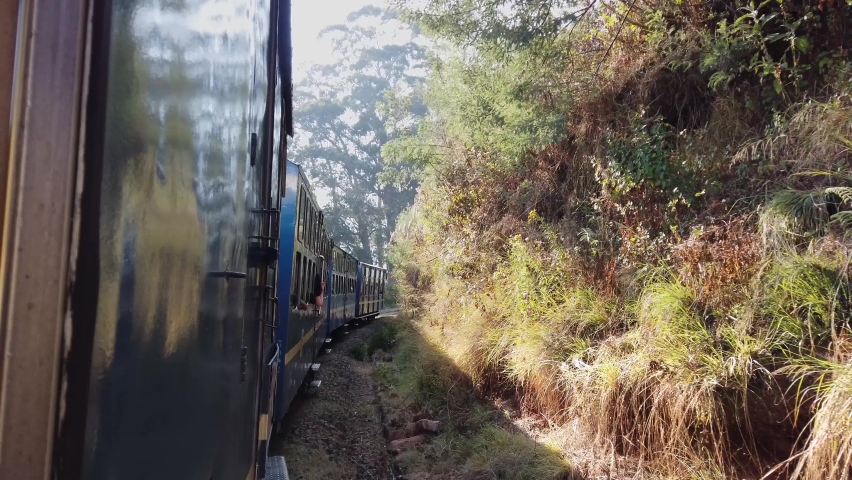 Tourists are enjoying Nilgiri mountain railway Toy train ride. Summer holidays in Ooty. Nilgiris, Tamilnadu, India.