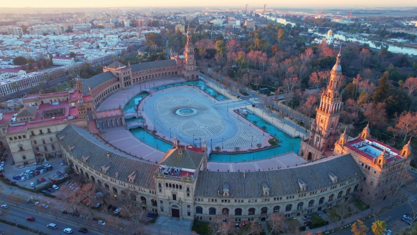 Plaza de Espana in Seville, aerial view in the morning at sunrise, flying around famous Seville landmark, high angle view of downtown Seville, drone shot of Seville skyline. High quality 4k footage