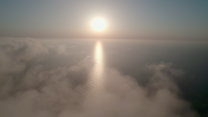 Flight over the water, sea waves, sunrise. A flight over the surface of a calm ocean. Royalty-Free Stock Footage #1088534021