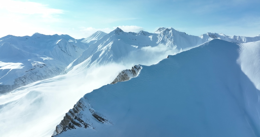 Aerial view of beautiful snowy mountains in Gudauri, Georgia Royalty-Free Stock Footage #1088534395
