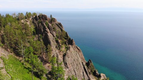 Beautiful scenic view of the Skriper cliff, Lake Baikal on a sunny summer day. Aerial view. 