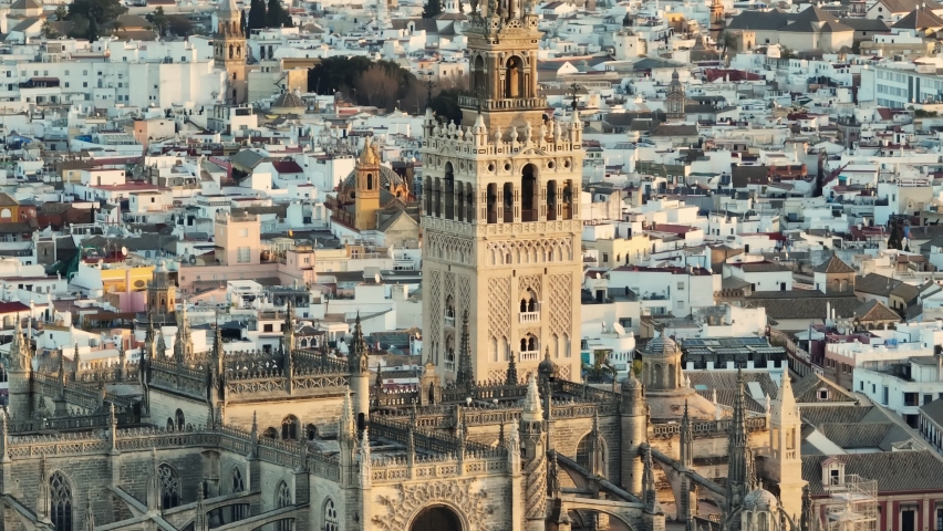Aerial tele shot of gothic cathedral in Seville, Andalusia, Spain. Famous Giralda bell tower, Sevilla - capital city of Spain